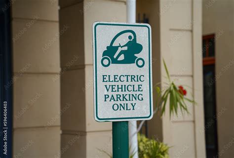 electric vehicle parking only sign Stock Photo | Adobe Stock