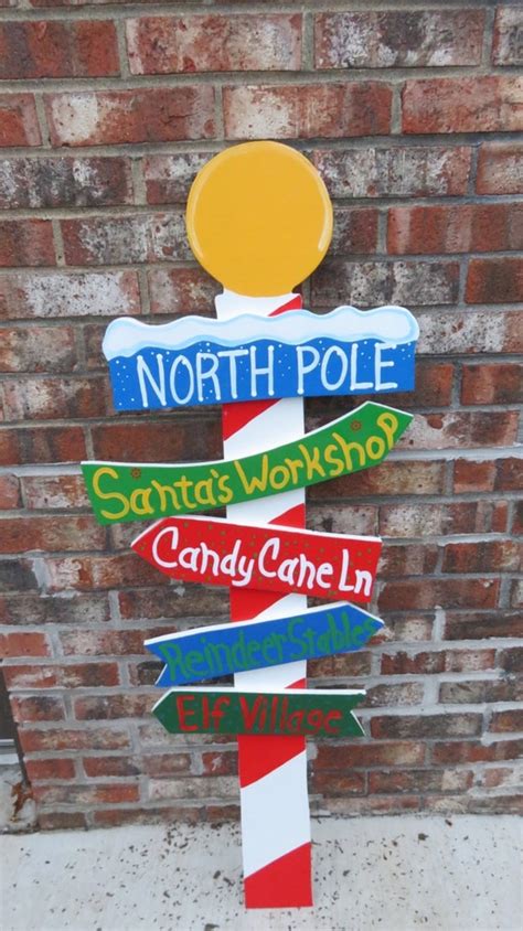 Christmas North Pole Sign With Direction Signs By Chartinisyardart