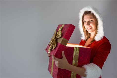 Premium Photo Festive Pretty Brunette Opening A Gift