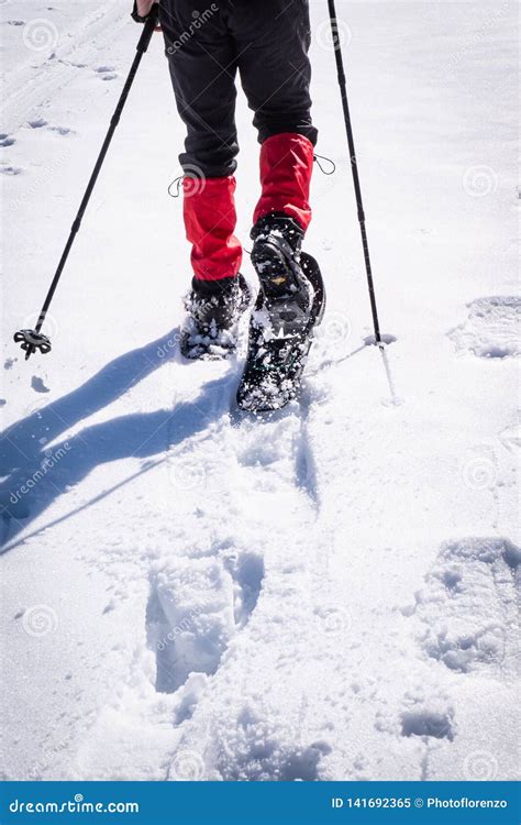 Close-up of Man Hiking with Snowshoes through Snow on Winterday Stock ...