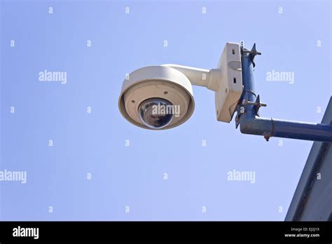 Hi-tech dome type surveillance camera over blue sky Stock Photo - Alamy