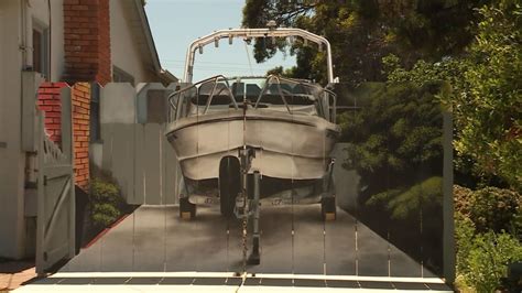 Man Gets Realistic Picture Of His Boat Painted On A Fence Intended To