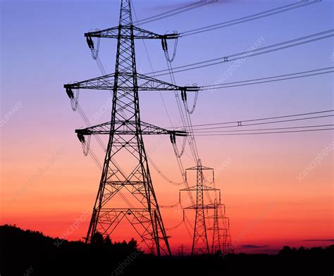 Electricity Pylons Transmission Lines At Sunset Stock Image T