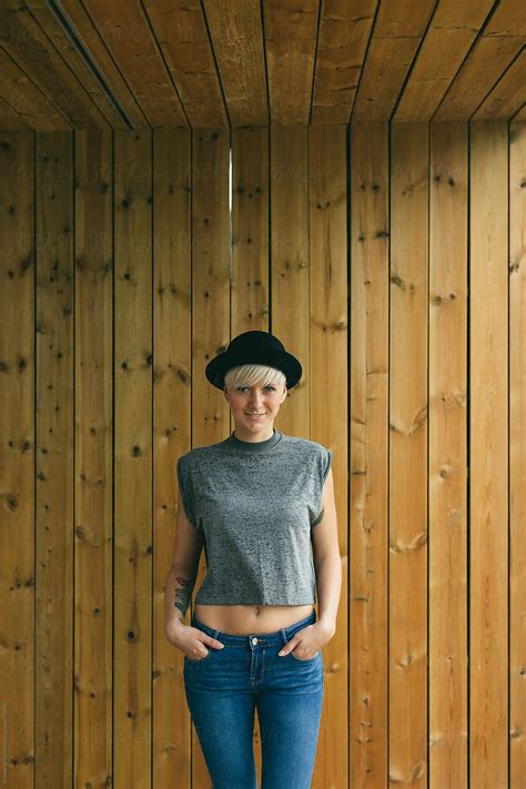 Blonde Woman Posing In Front Of A Wooden Wall By Stocksy Contributor BONNINSTUDIO Stocksy