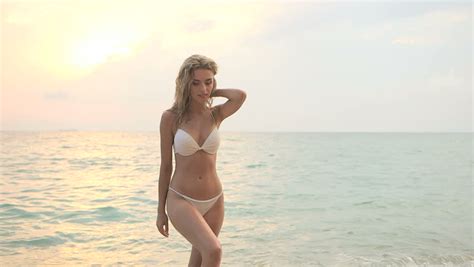 A Beautiful Sexy Woman In White Bikini Sunbathing By The Sea Stock Footage Video