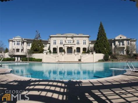 Report: Rick Ross Buys Evander Holyfield's Mansion | realtor.com®