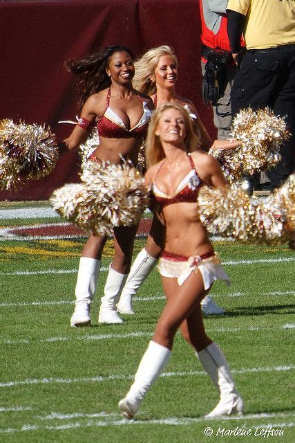 The Cheerleaders Are Performing On The Field