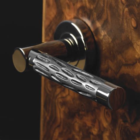 Turnstyle Design Door handle - Amalfine - Black bronze / Polished brass ...