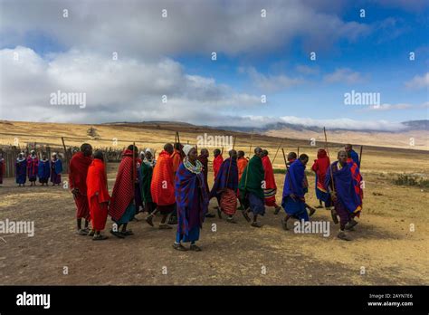 NGORONGORO TANZANIA AUGUST 16 2019 Masai Men In Colorful Clothes