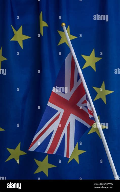 Brexit concept. Union Jack against crumpled EU European Community flag ...