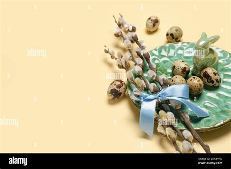 Plate With Easter Quail Eggs And Pussy Willow Branches On Beige Background Stock Photo Alamy