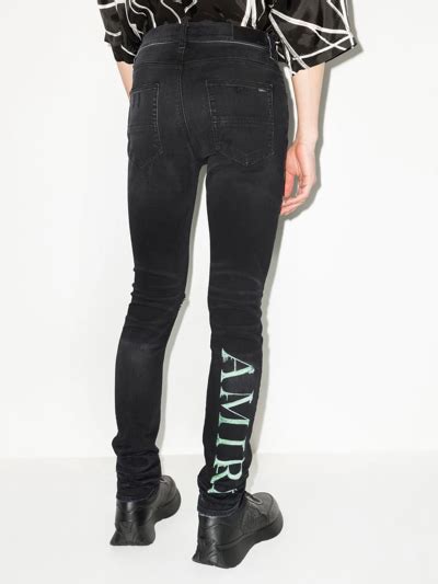 Amiri Watercolour Logo Print Skinny Jeans In Black Modesens