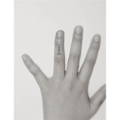 Micro Candle Tattoo Placed On The Finger Minimalistic