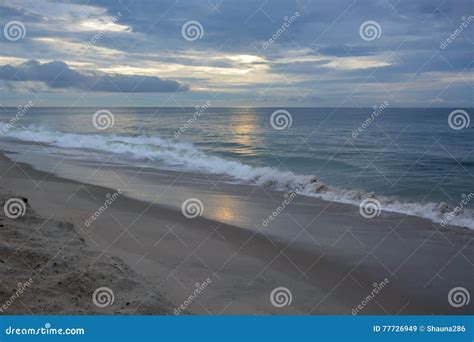 Early Morning Beach Walk At Sunrise With Heavenly Skies Stock Image