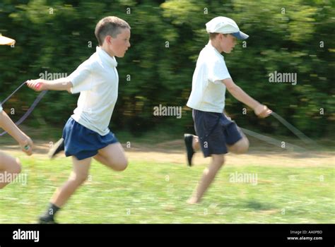 Boys competing in a skipping race Stock Photo - Alamy