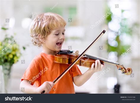 5,909 Kid Playing Violin Images, Stock Photos & Vectors | Shutterstock