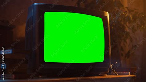 Close Up Footage Of A Dated Tv Set With Green Screen Mock Up Chroma Key