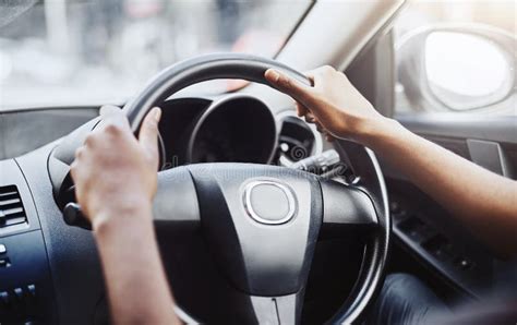 Drive Hands On Steering Wheel And Travel With Person In Car For