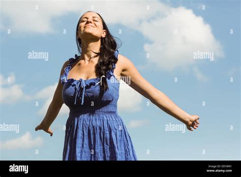 Pretty Brunette In Dress Enjoying The Sunshine Stock Photo Alamy
