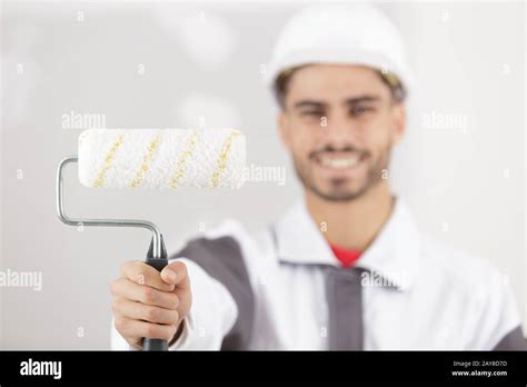 Painter Man Showing Paint Roller Stock Photo Alamy