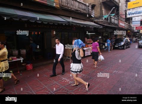 A Chinese Sex Worker From Hong Kong Walks Across The Street In Bangkok