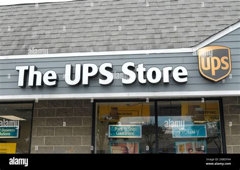 A Ups Store Sign Is Seen In The Hicksville Neighborhood In Long Island