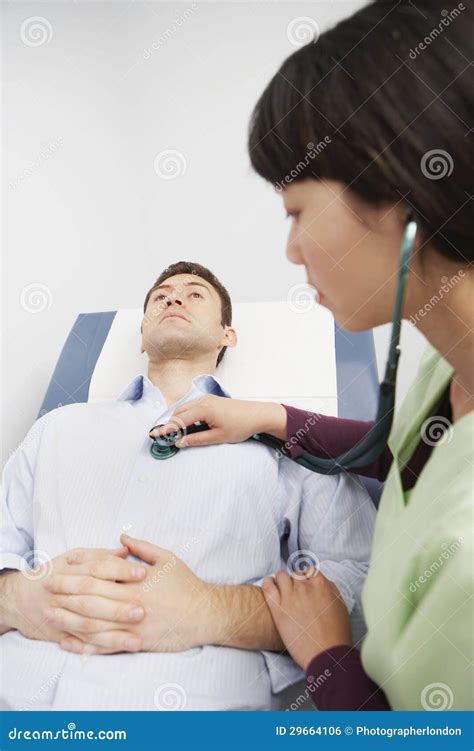 Doctor Examining Patient With Stethoscope Royalty Free Stock Image