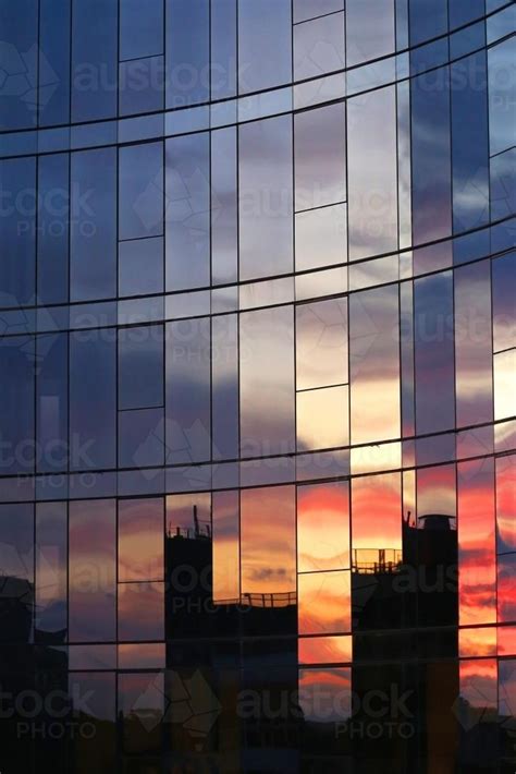 Image Of City Sunset Reflections In Windows Of Tall Building Austockphoto