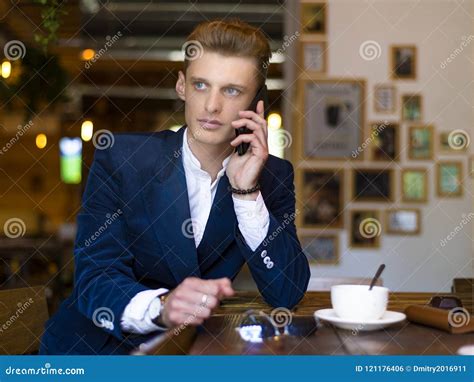 Closeup Portrait Of Serious Handsome Man Talking On Smartphone And