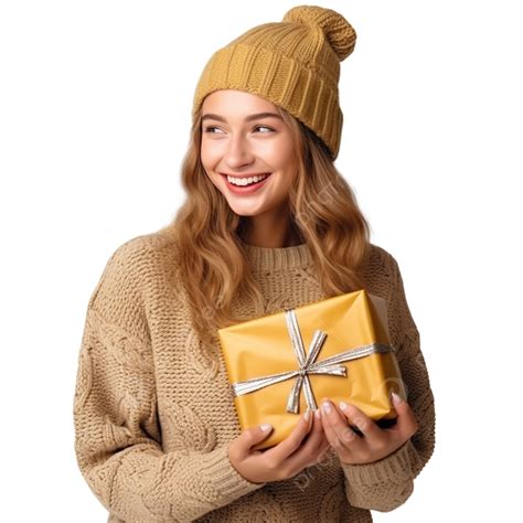 A Girl In A Warm Knitted Sweater And Mittens Is Holding A Christmas