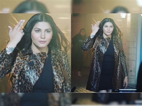 Sapna Choudhary In Black Short Dress With Tiger Print Leather Jacket