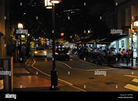 Singapore street and restaurant at night Stock Photo - Alamy
