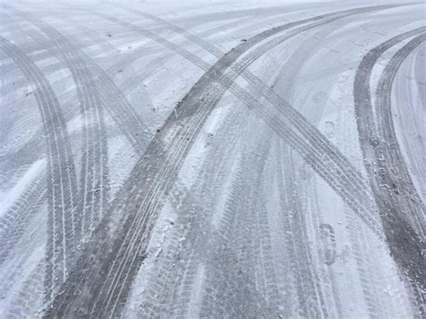 Premium Photo Full Frame Shot Of Tire Tracks On Road During Winter