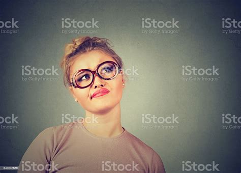 Confused Skeptical Woman In Glasses Thinking Planning Looking Up Stock