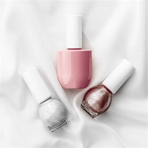 Premium Photo Nail Polish Bottles On Silk Background French Manicure