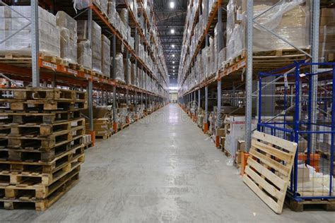 Row With Racks Of Goods On Shelves Inside Warehouse Stock Image Image