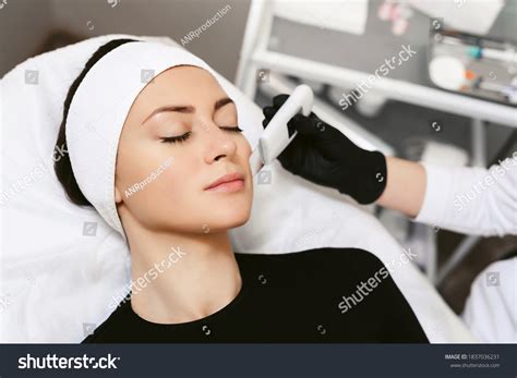 Beautician Ultrasonic Scrubber Doctor Doing Procedure Stock Photo