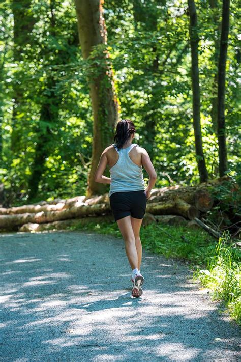 Woman Running In The Forest Photograph By Frank Gaertner Fine Art America