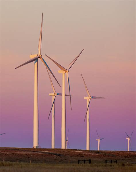 Wind Turbine Farm Against Beautiful Sky During Sunset Photograph By Cavan Images Pixels