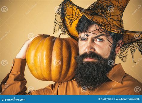 Halloween Man With Pumpkin Holidays Celebration Concept Scary Hipster Man With Beard In