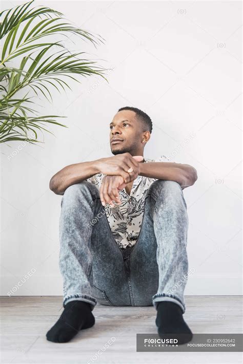 Man Sitting On Ground