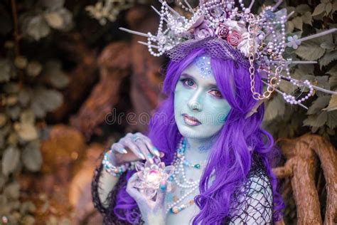 Fabulous Mermaid with Blue Skin in Foliage Close Up Stock Image - Image ...