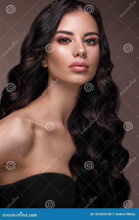 Beautiful Brunette Model Curls Classic Makeup And Full Lips The Beauty Face Stock Photo
