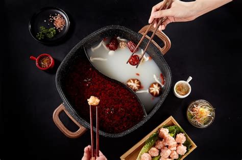 Premium Photo Mandarin Duck Pot On Black Background Spicy Hot Pot And Health Hot Pot