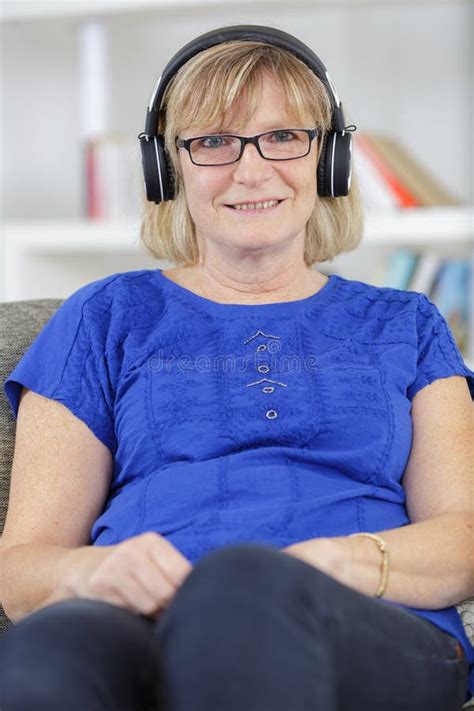 Mature Woman Listening To Music On Wireless Headphones Stock Photo Image Of Application Elder