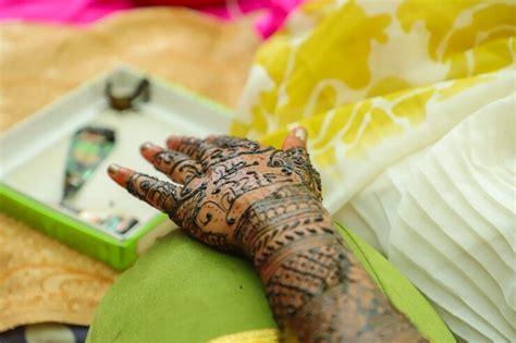 Premium Photo | An indian bride showing her hand's mehndi tattoos design