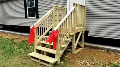 A Set Of Stairs With Red Ribbons On Them