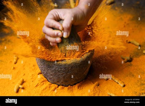 Woman Hand Powdering Indian Spices Turmeric Powder Splash Explosion