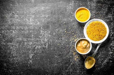 Premium Photo Different Types Of Mustard With A Spoon