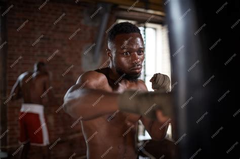 Premium Photo | Boxer training in gym